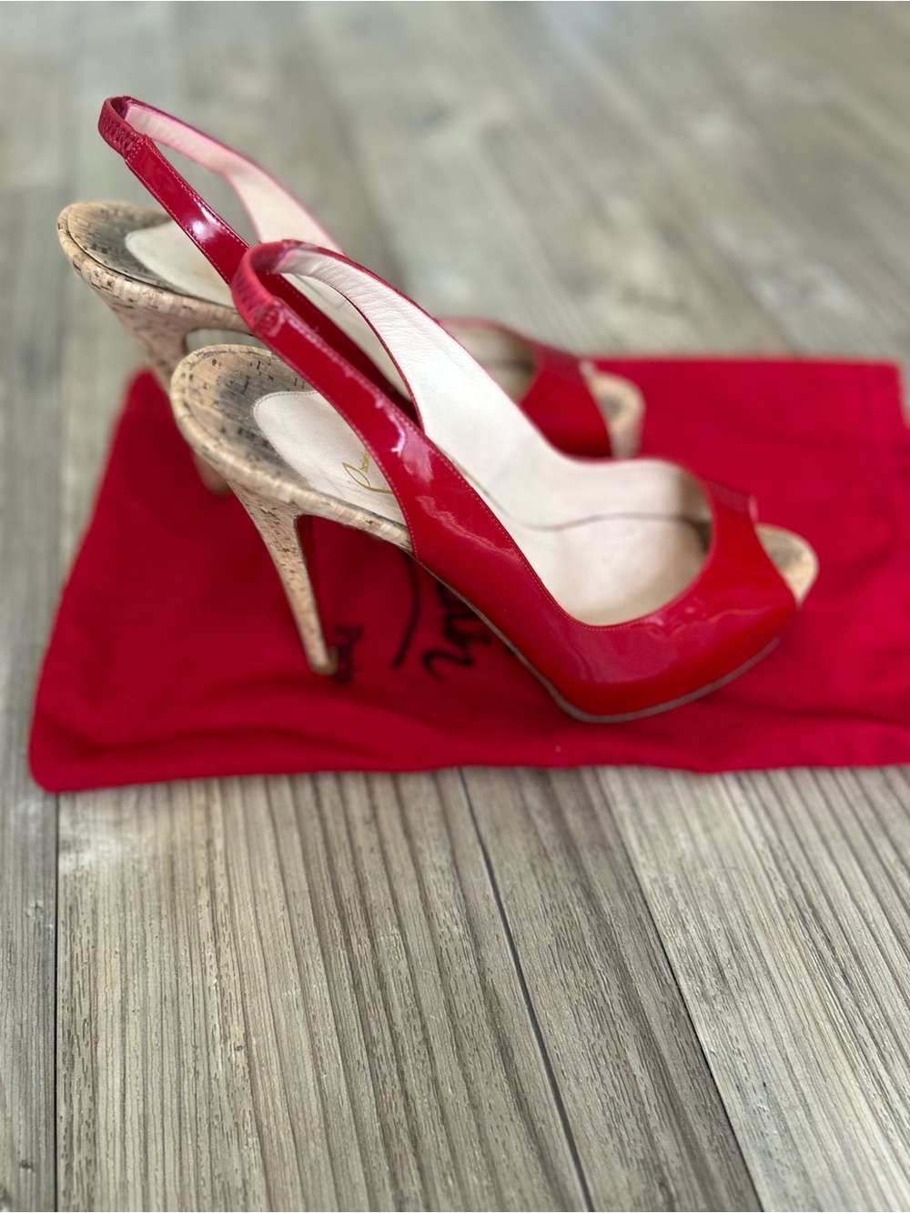 Christian Louboutin So Private 120 cork slingback pumps in red patent leather.